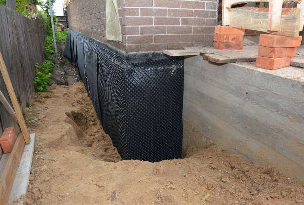 Happy homeowners after waterproofing job in New Carlisle